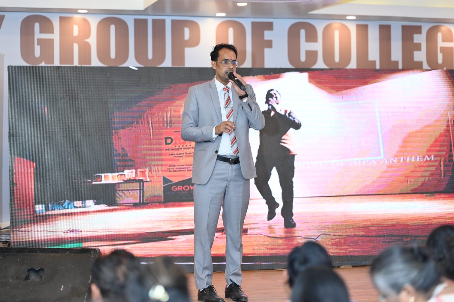 A speaker on stage during the AIPA anthem